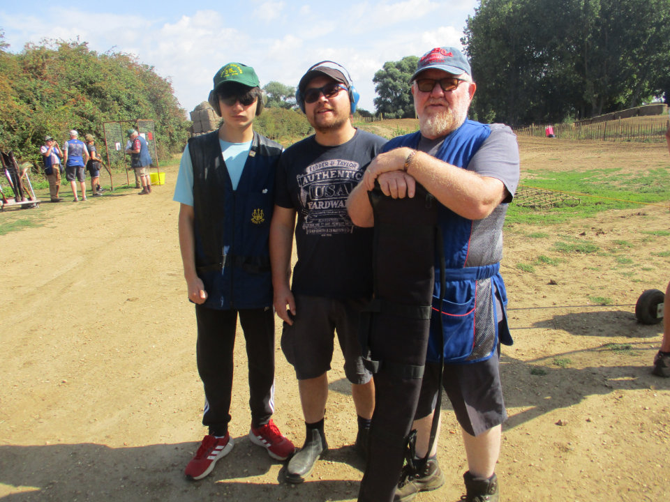 Grandfather, son and grandson shooting as a family
